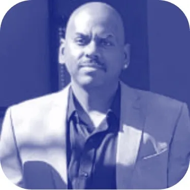 A person in a suitDescription automatically generated